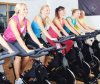 21511366-Beautiful-women-doing-exercise-in-a-spinning-class-at-gym-Stock-Photo.jpg