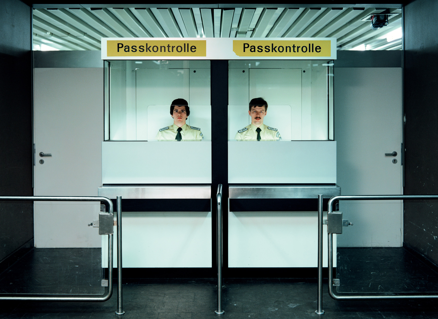 Andreas Gursky - Doorman, Passport Control 1982 (2007).jpg