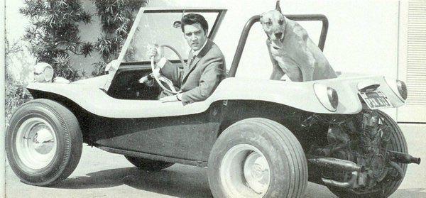 Elvis Presley with his dog in a dune buggy, 1968.jpg